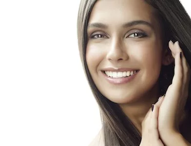 woman smiling after receiving dental veneers in Lake Forest, CA