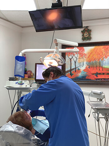 Dr. Narkhede providing same-day emergency dental treatment for a patient