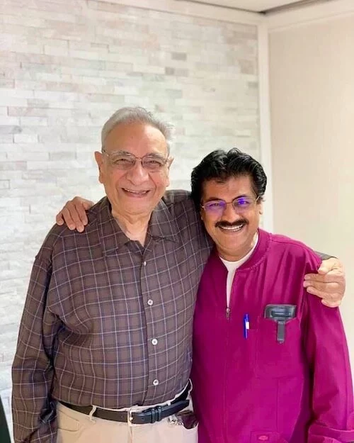 Dr. Narkhede smiling with a patient at his office in Lake Forest, CA