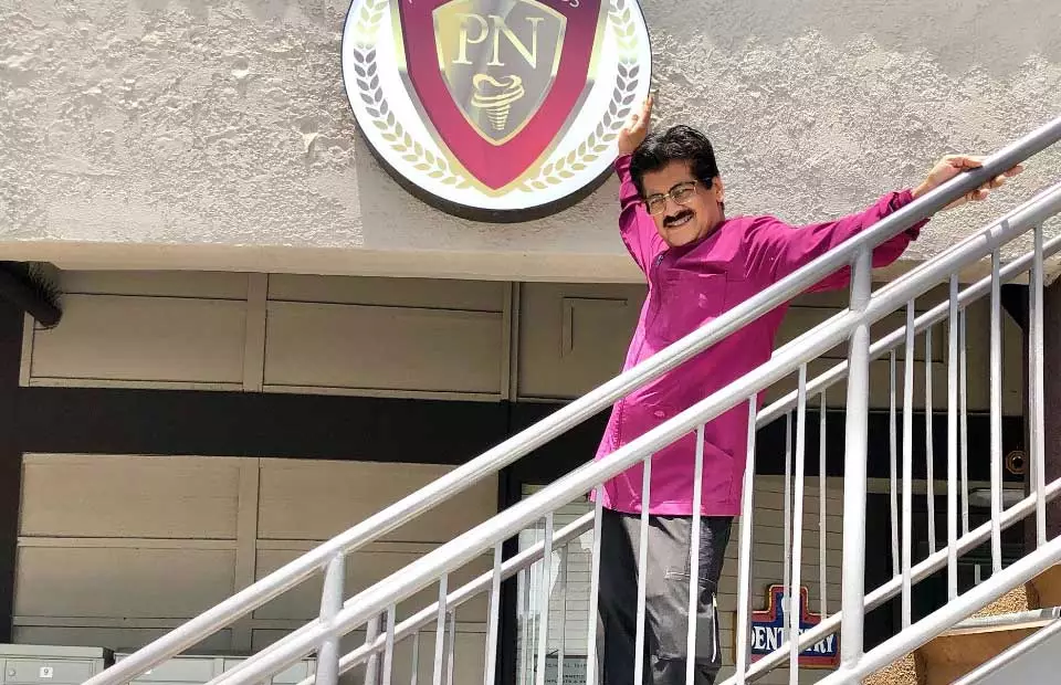 Lake Forest, CA dentist Dr. Pankaj Narkhede standing in front of his office